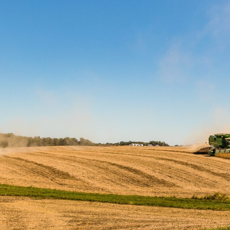Combine harvester working in hilly terrain